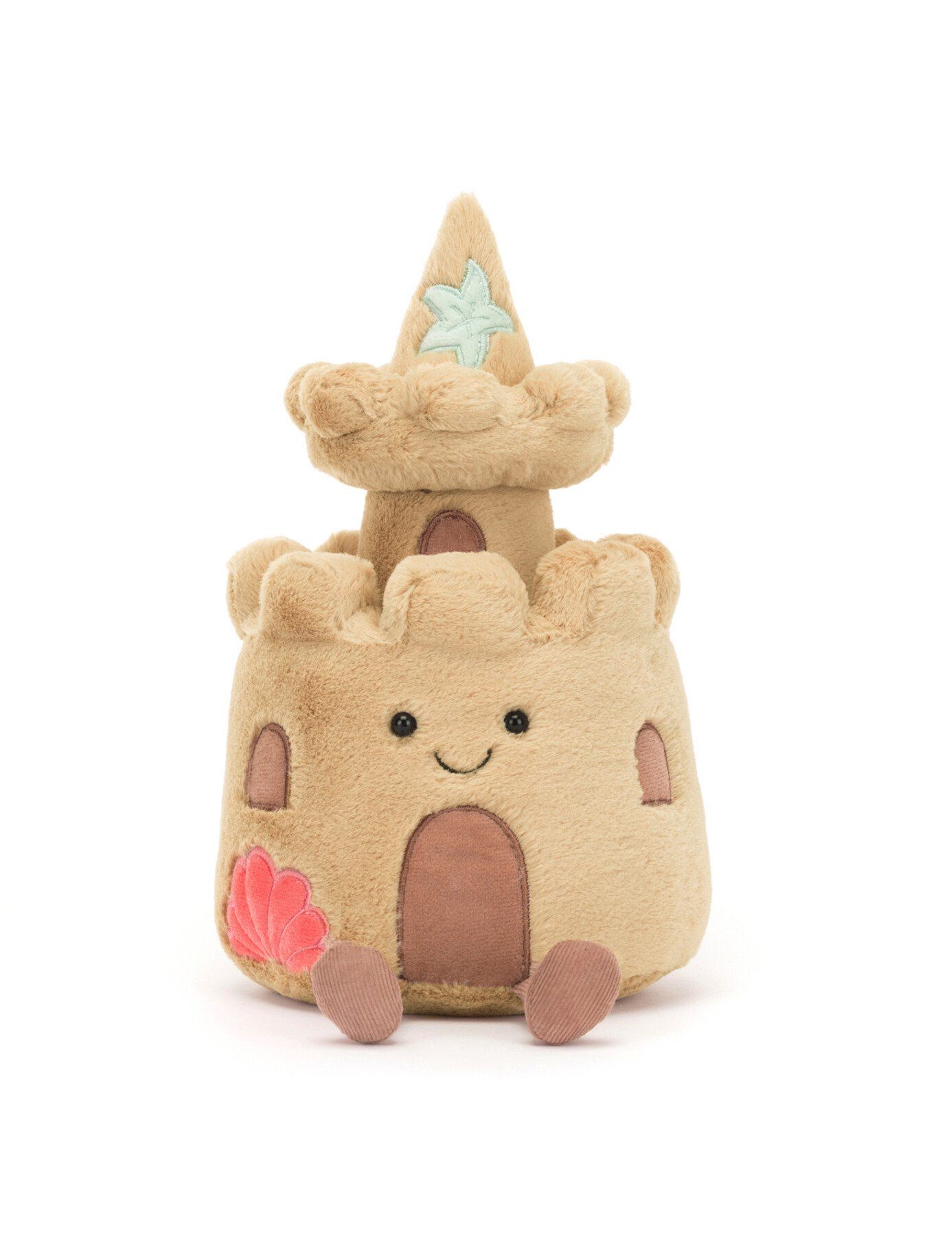 'a stuffed toy castle with a smiling face'