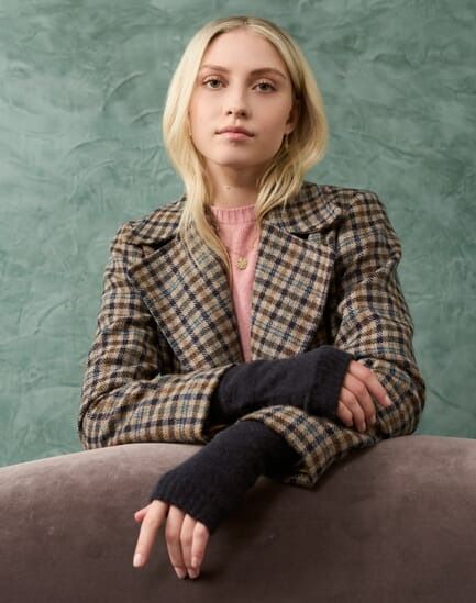 All of Claudia Winkleman's best Traitors outfits, from tweed