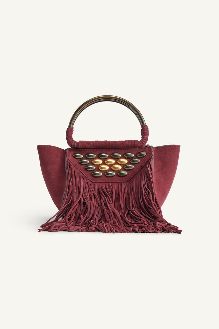 bolsos de Zara edición limitada con flecos y tachuelas estilo Isabel