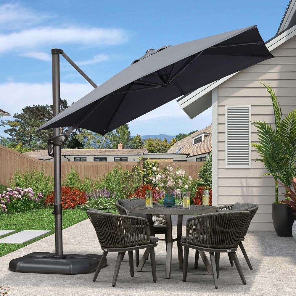 costco umbrella patio with stand Costco has this beautiful outdoor umbrella with rotating stand  @miradoroutdoor  It has Sunbrella fabric, a no-rust aluminum frame, and  the rolling base makes it easy to move wherever you need shade.